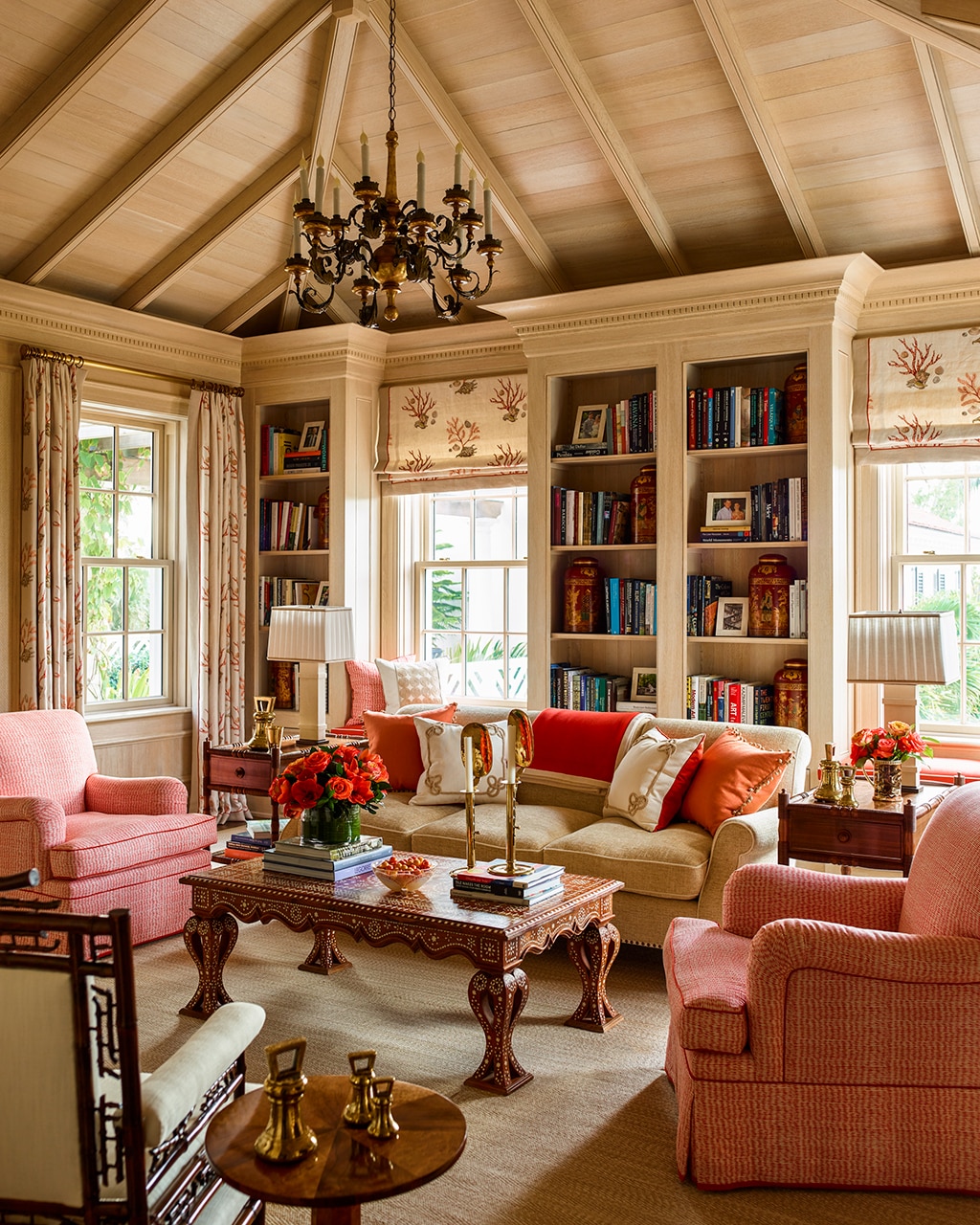 Living room with accents of coral in a Palm Beach project designed by Cullman & Kravis