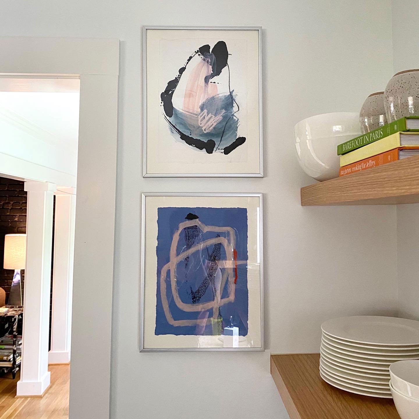 Pair of art pieces in kitchen