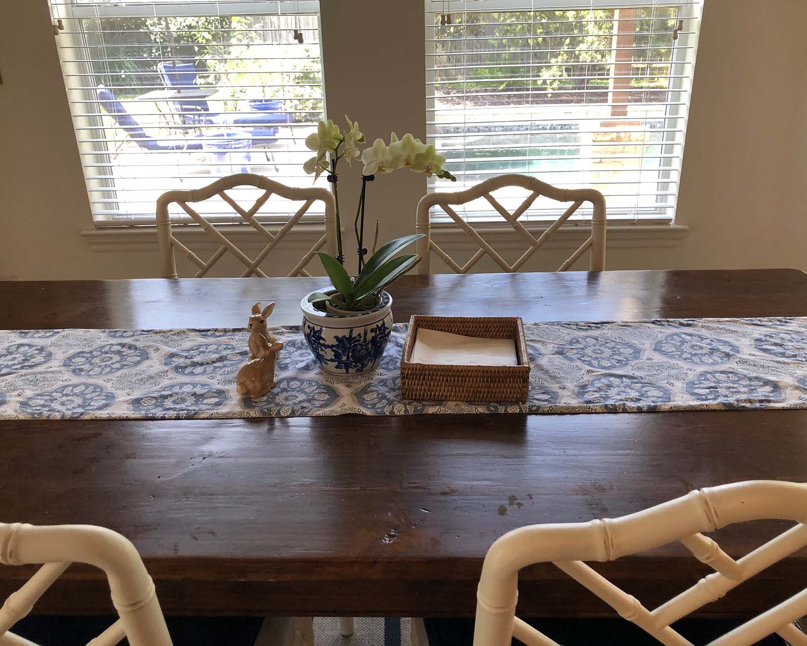 Mirna's wood farm table with white Dayna chairs from Ballard