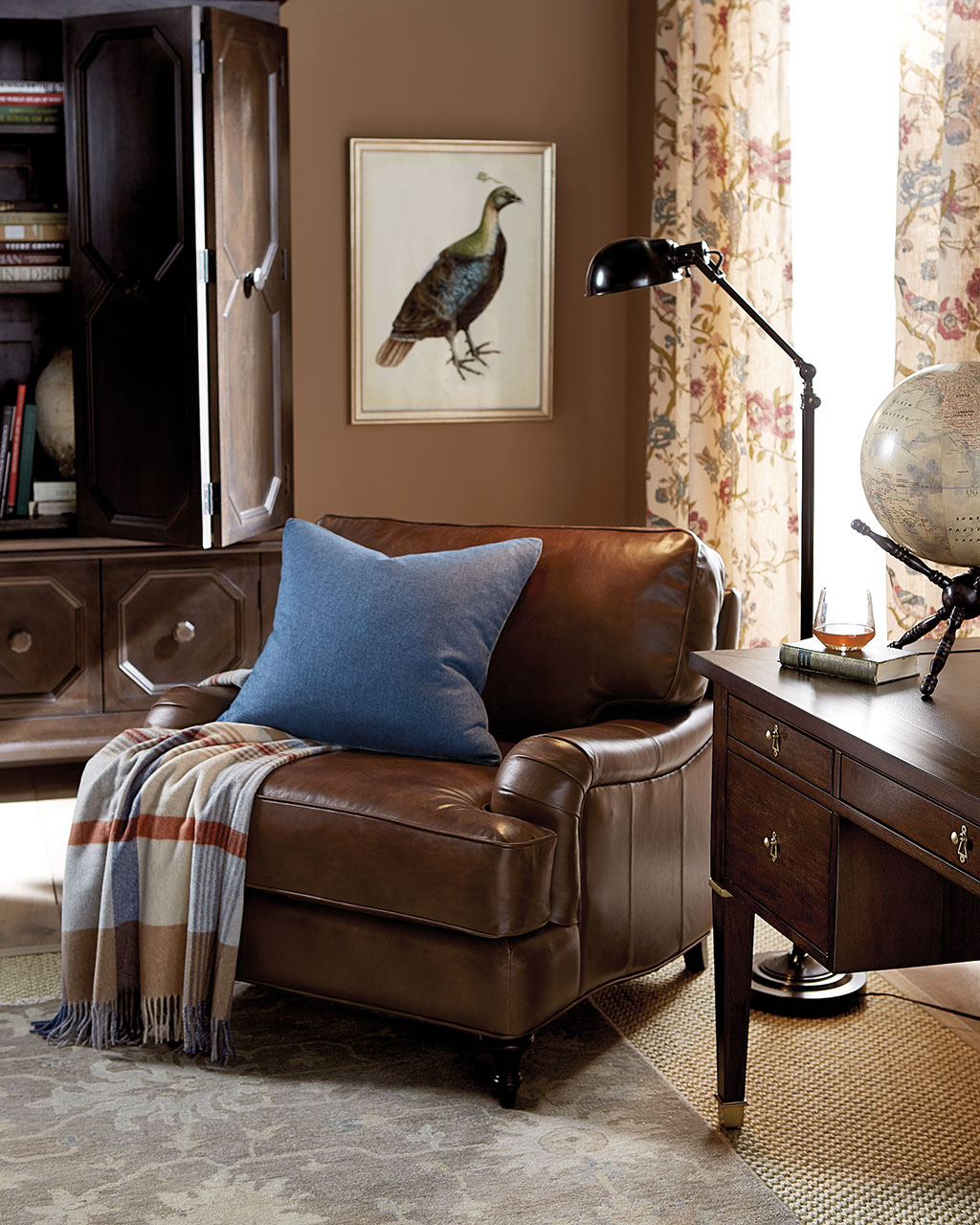 A chocolate colored leather furniture chair in a living room