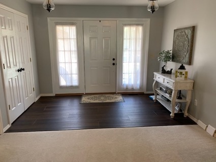 Tara's entryway with front door and side windows