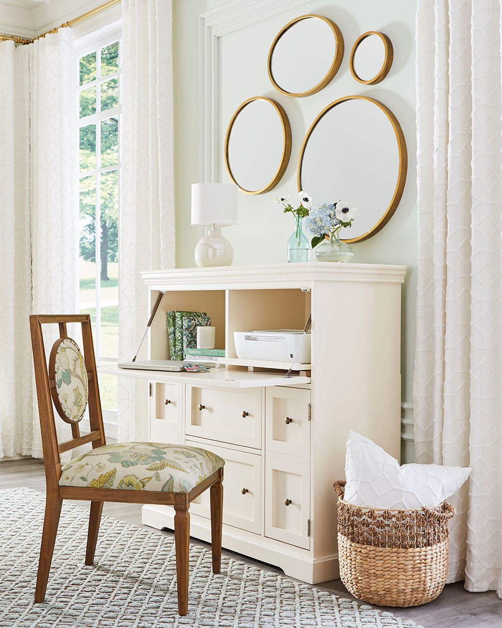 Carve out a new room with a secretary desk and upholstered chair