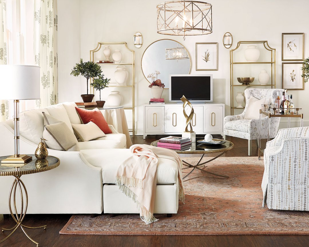 White living room with bookshelves and patterned rug