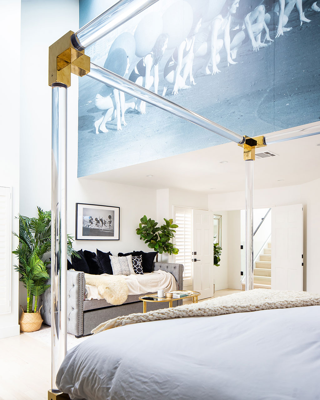 Bedroom designed by Breegan Jane with lucite canopy bed