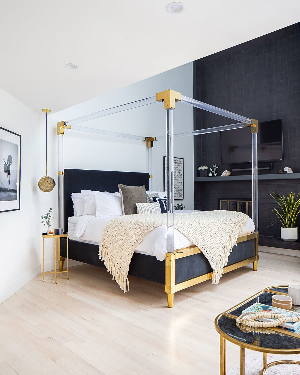 Bedroom designed by Breegan Jane with lucite canopy bed