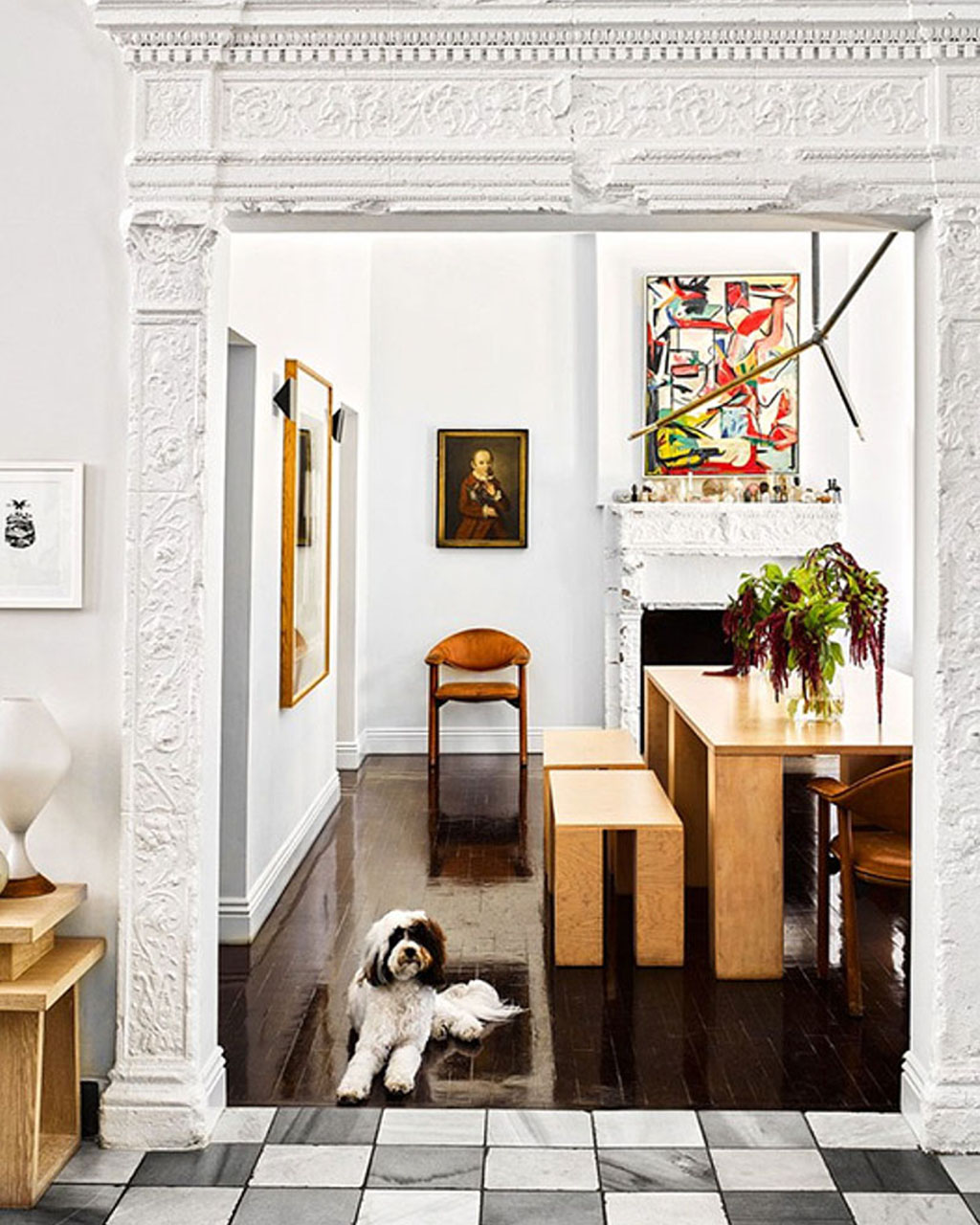 Dining room in Brigette's home with custom burlwood dining table and benches