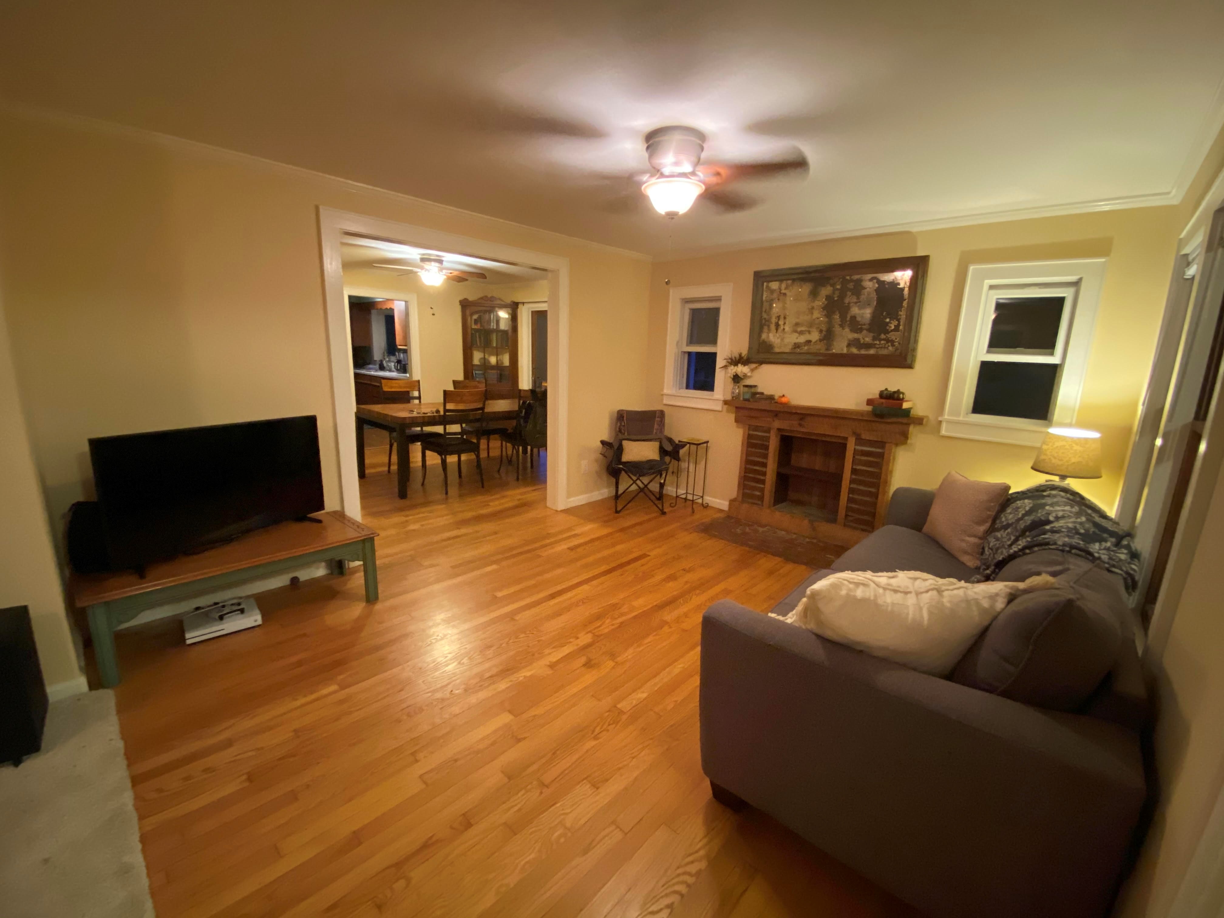 Fireplace in little bungalow with adjacent dining room