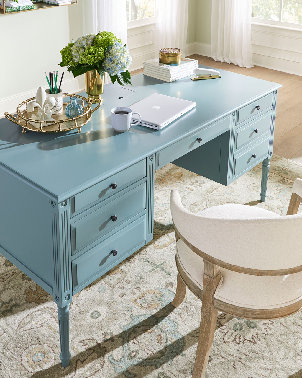 Create a work from home setup with an expansive desk surface from Ballard Designs