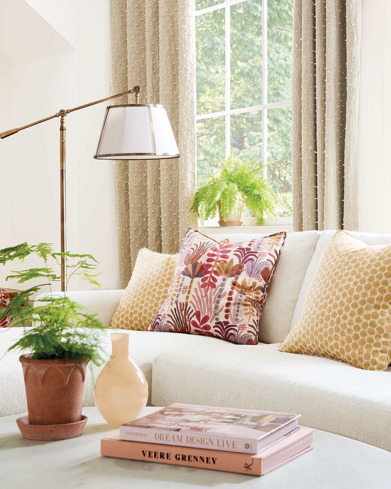 Cohesive color palette inspired by decorative pillow fabric in living room