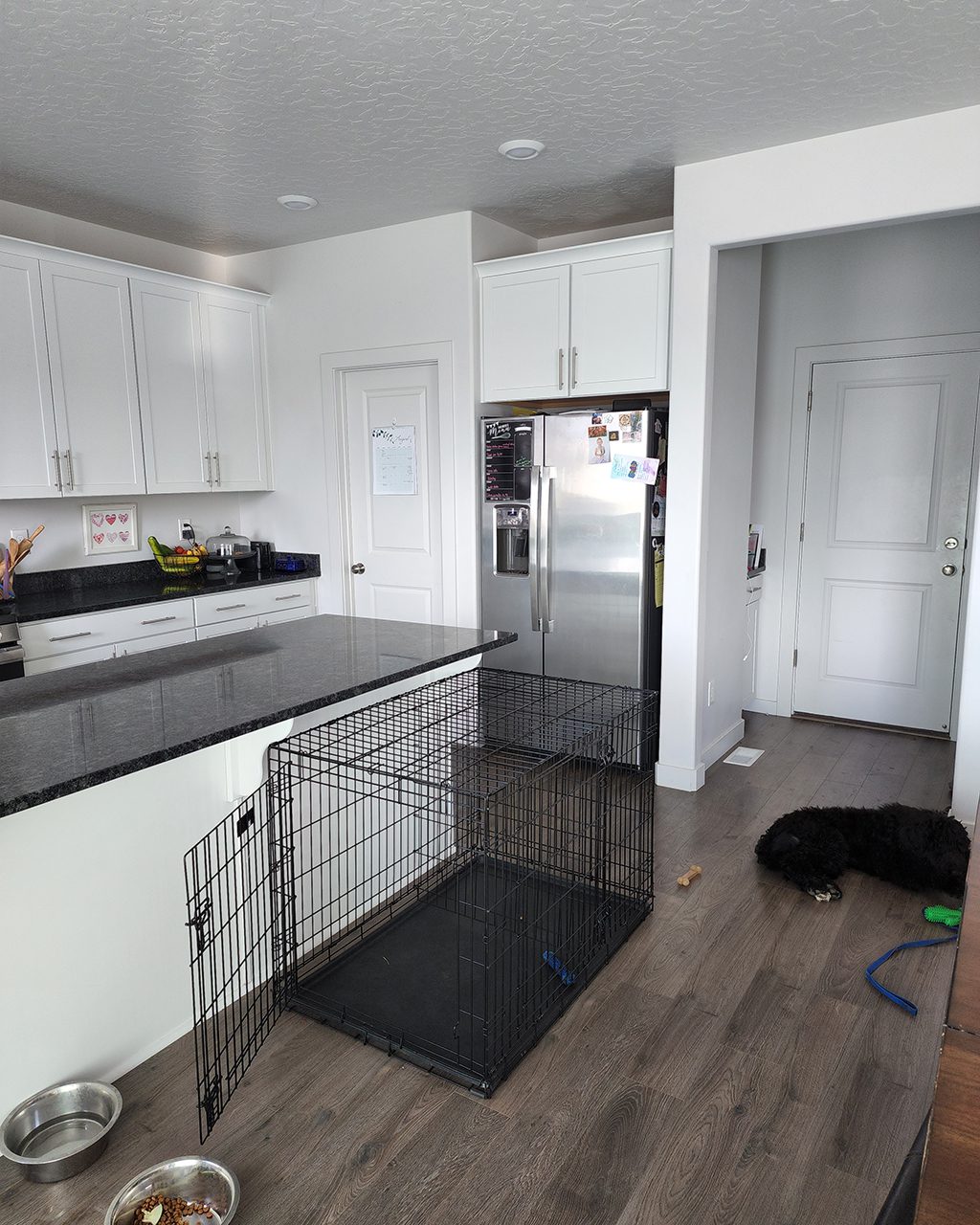 Jackie's white builder kitchen with black countertops