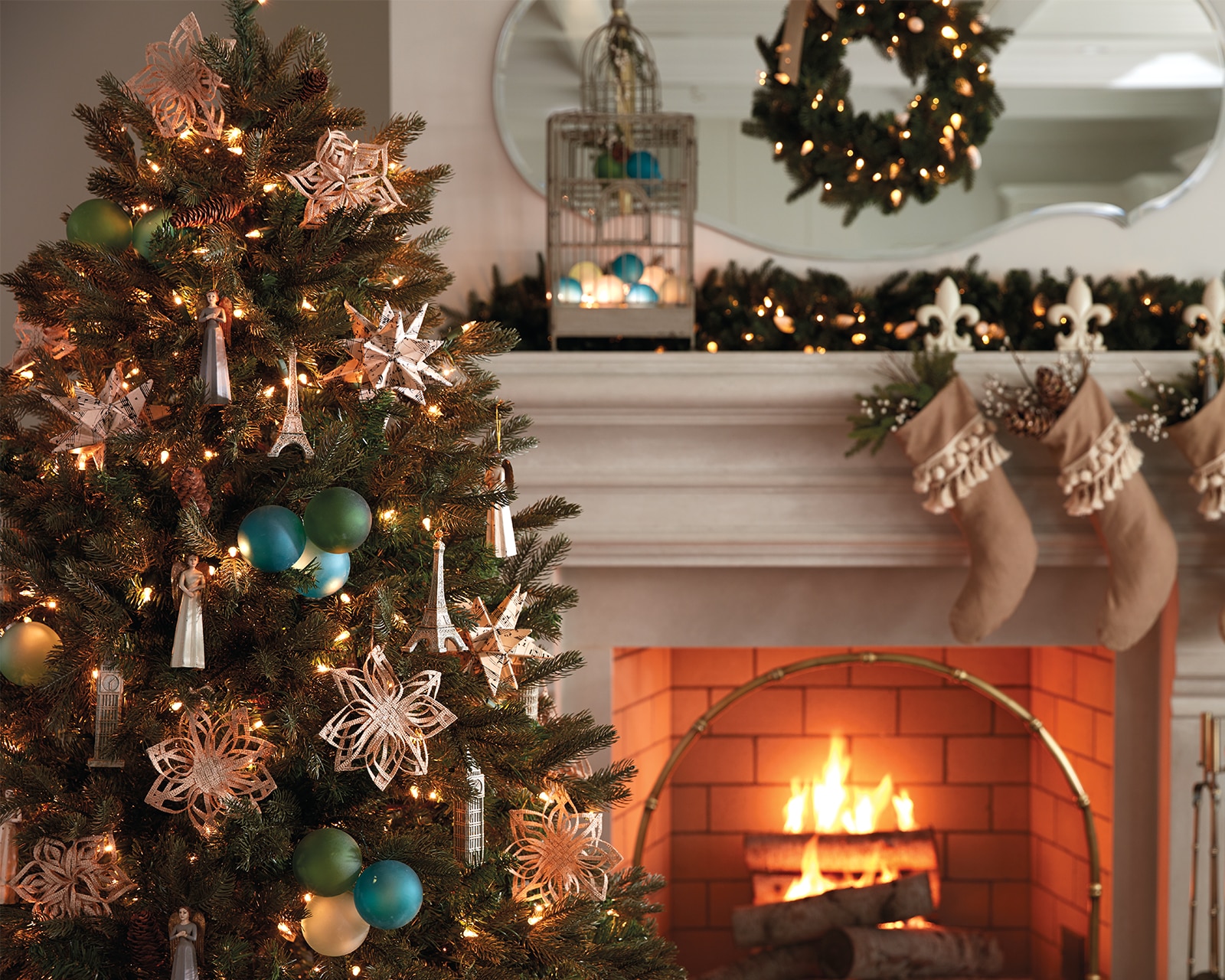 Christmas tree, wreath, and stockings beside fireplace