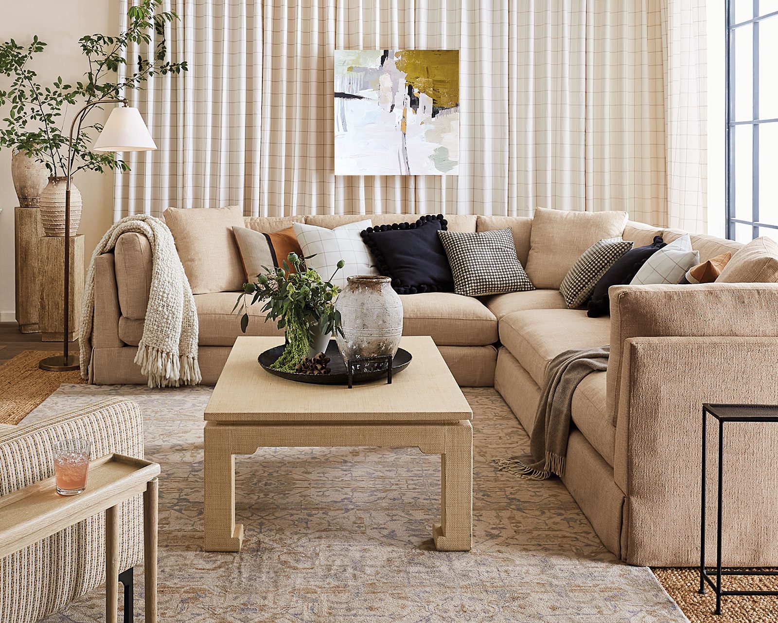 Large comfortable TV room with neutral furnishings from Ballard Designs